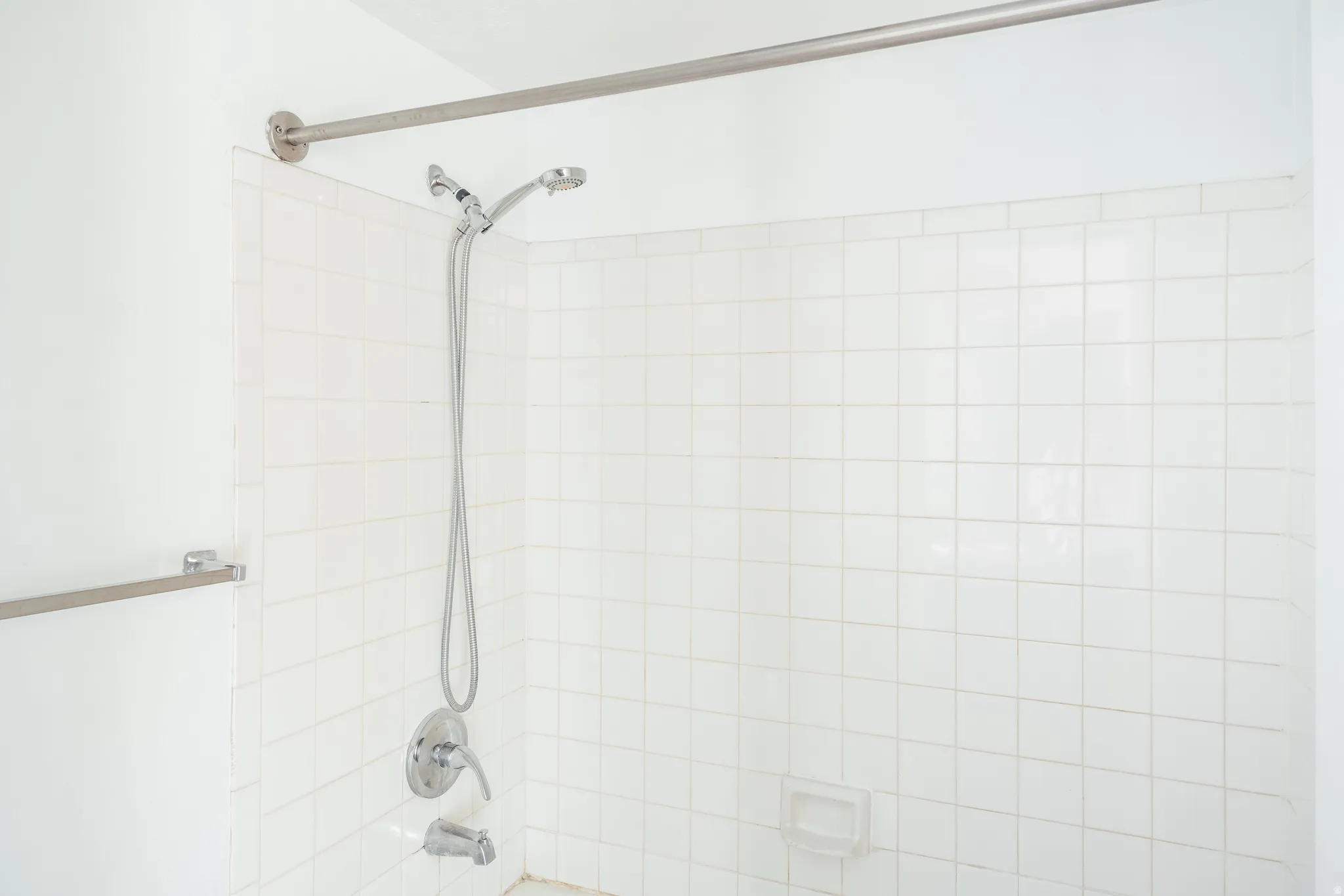 Bathroom view of shower / bath combination