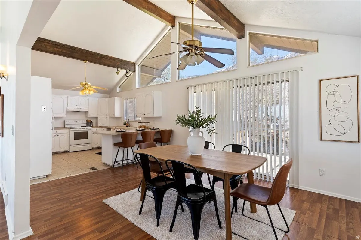 Dining room with a ceiling fan and light wood-type flooring