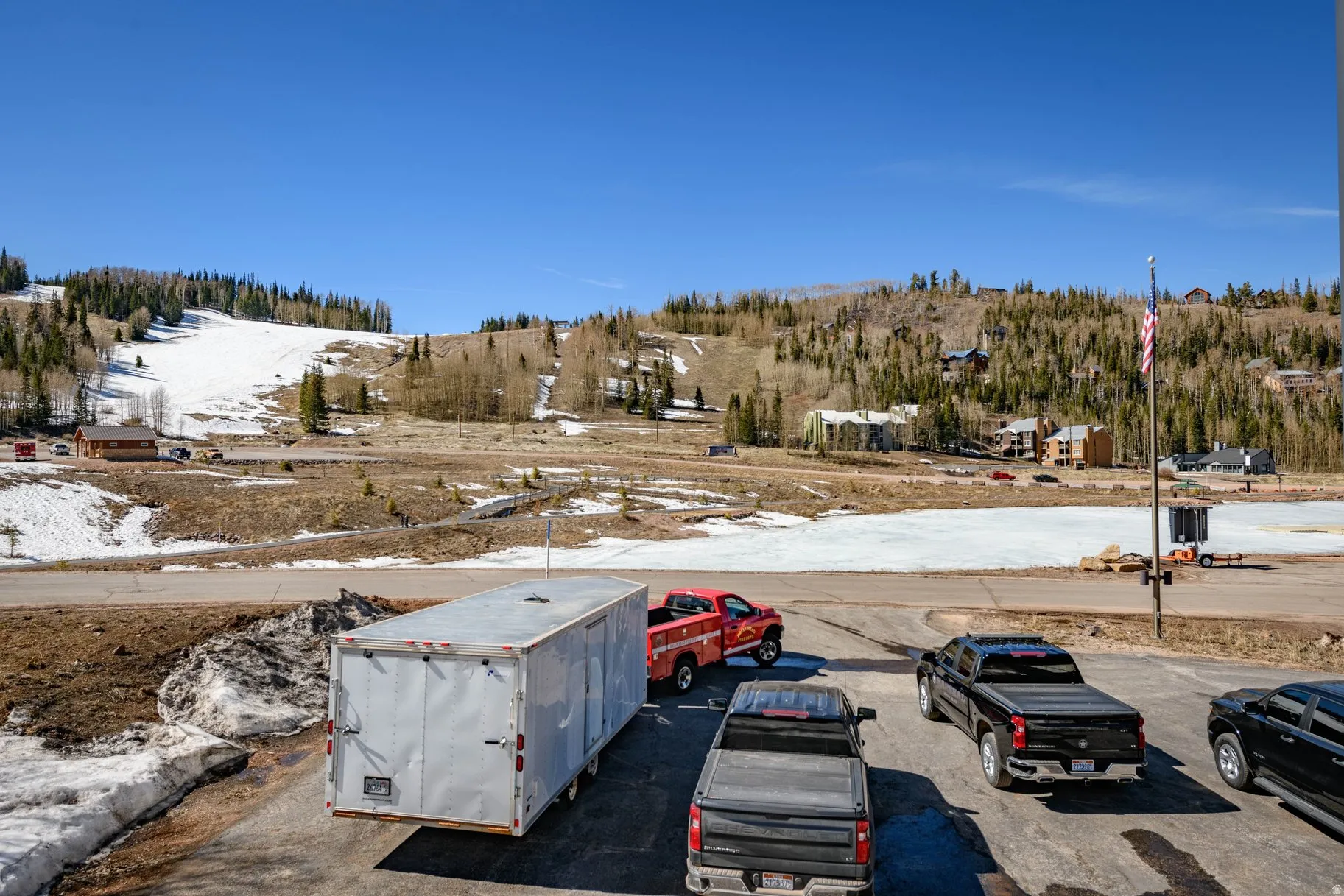 Snow covered parking area with uncovered parking