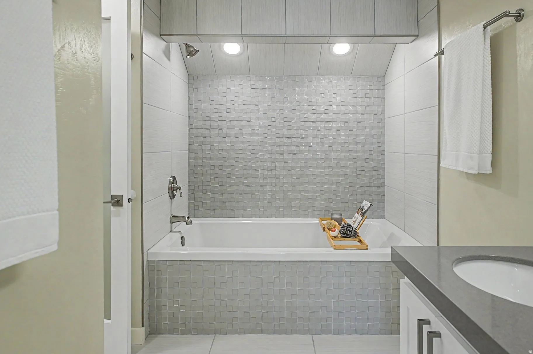Full bathroom with vanity, tiled shower / bath, and tile patterned flooring