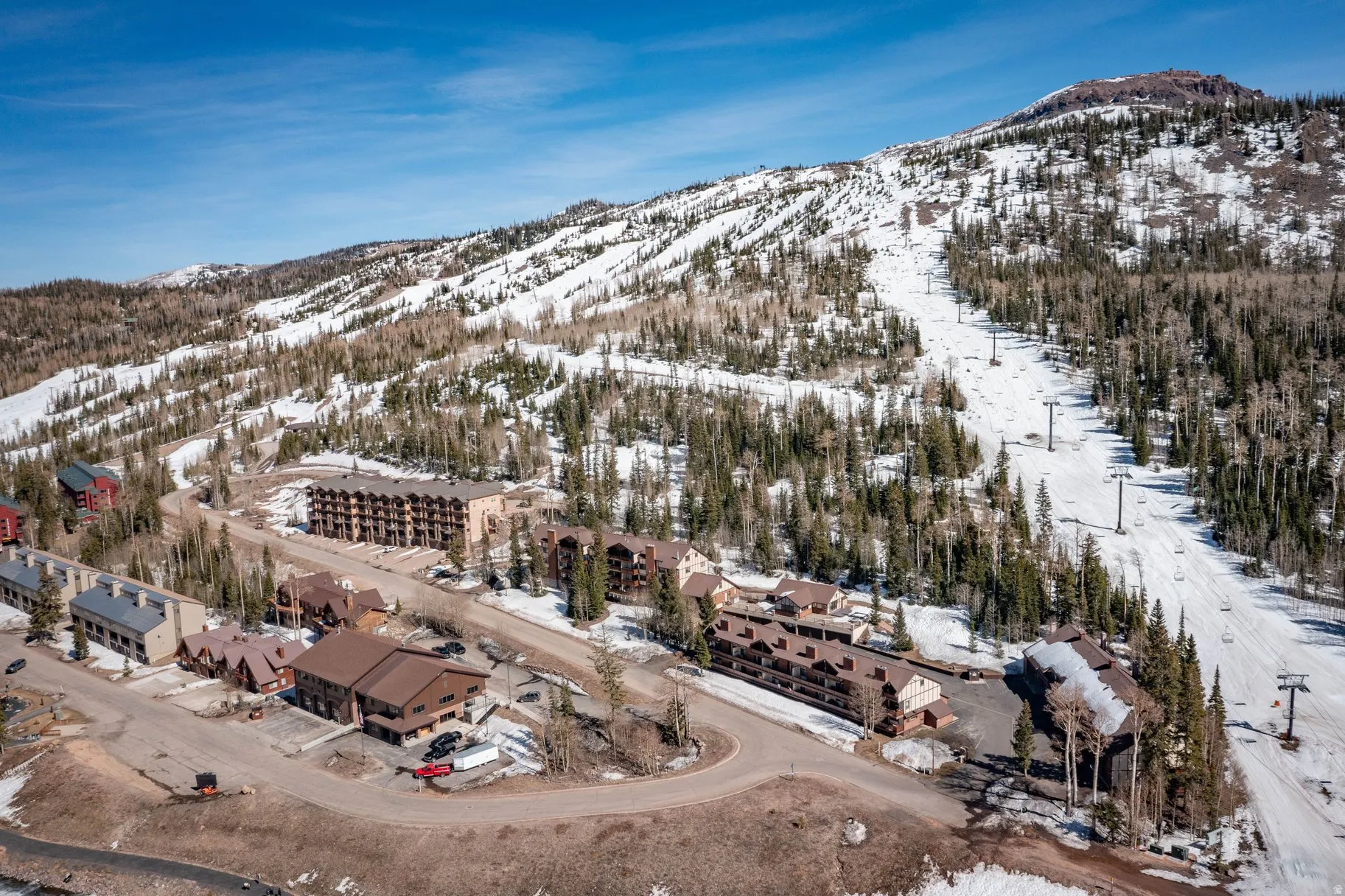 Snowy aerial view with a mountain view