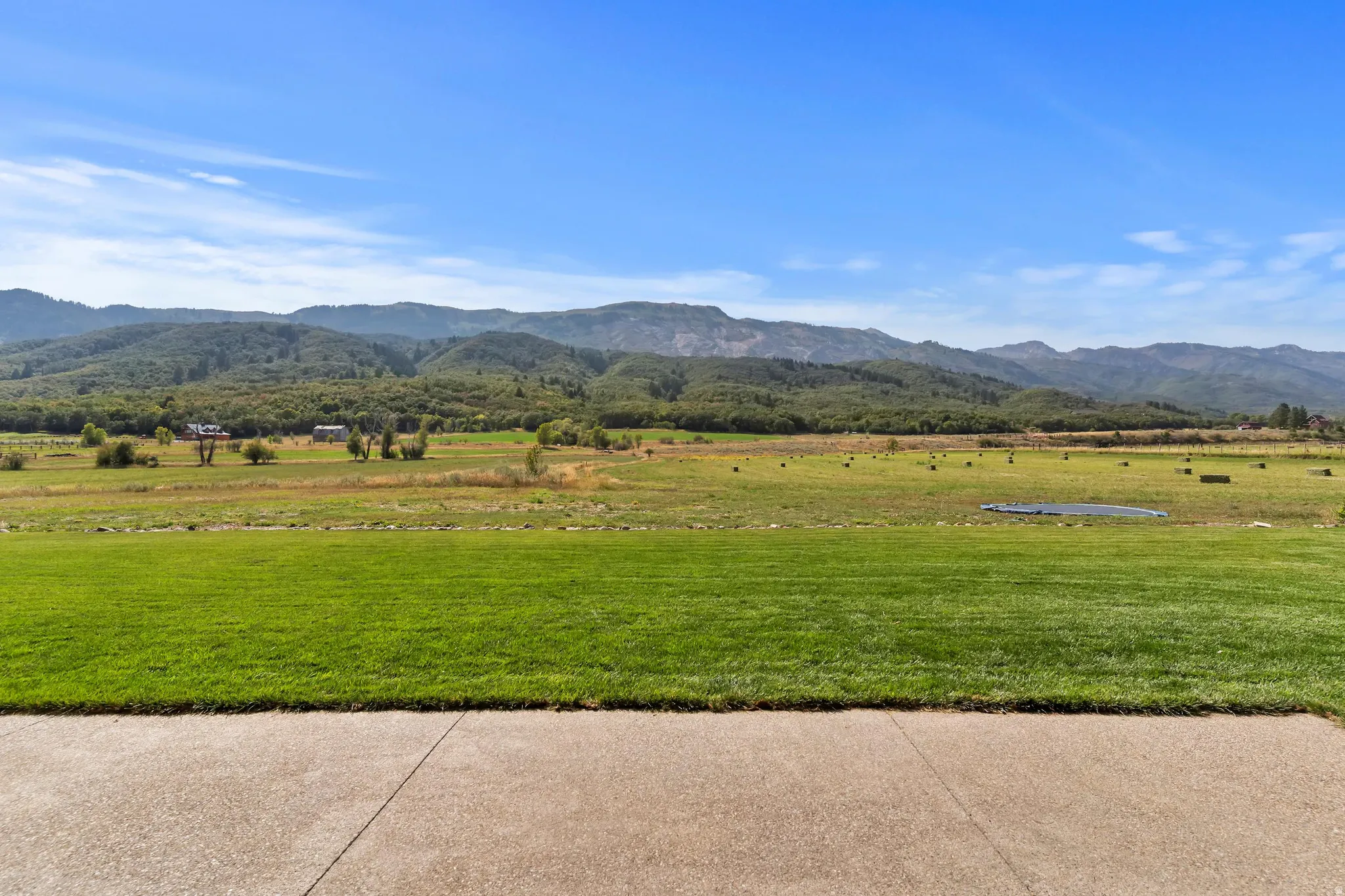View of mountain backdrop featuring rural landscape