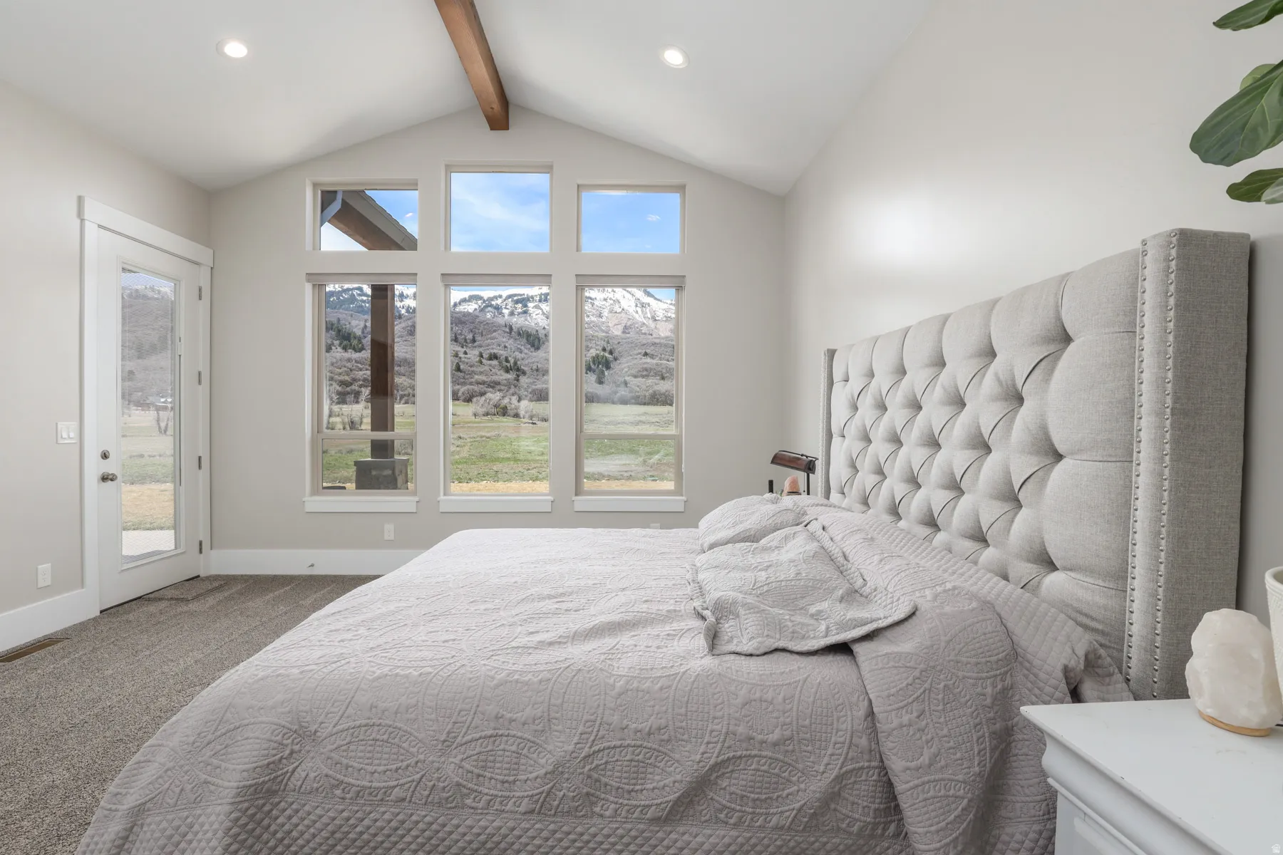 Bedroom with light carpet, beam ceiling, access to outside, a mountain view, and recessed lighting