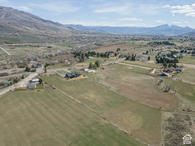 Aerial view of property's location featuring mountains and rural landscape