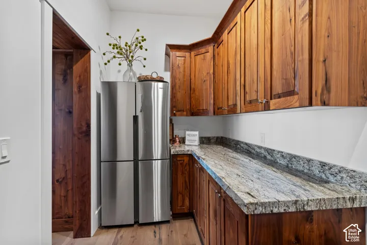 Butler pantry with walnut cabinets