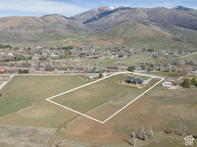Aerial view of property and surrounding area with property boundaries highlighted and rural landscape