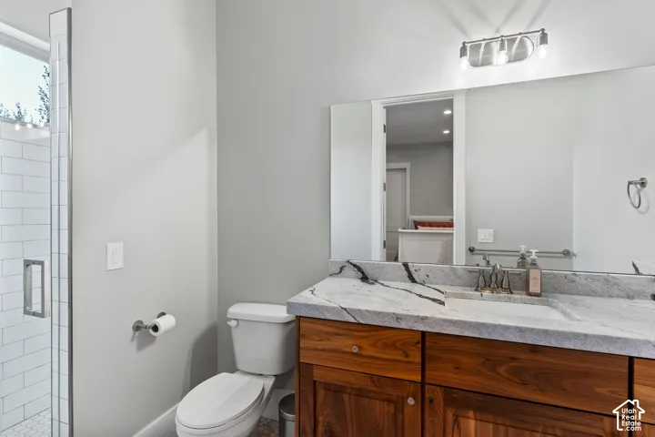 Bathroom with vanity and a shower stall