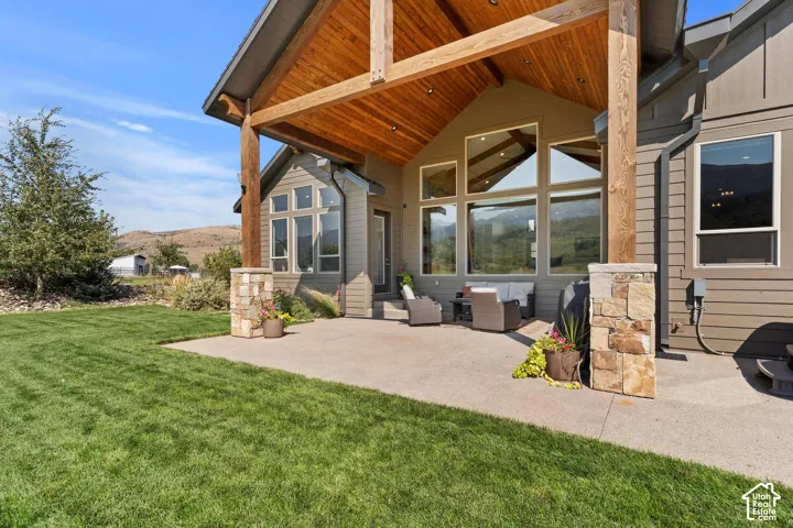Covered porch with custom timber beams. Watching the sunsets and summers under the shade.