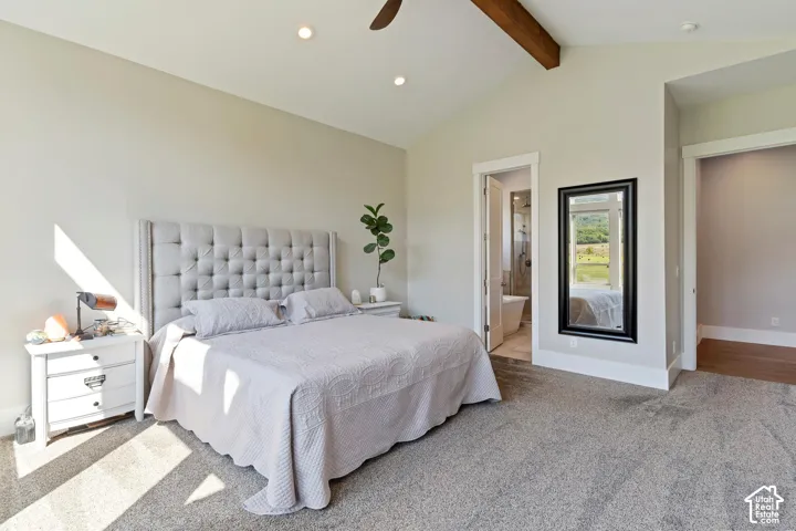 Primary Bedroom featuring light carpet, beam ceiling, recessed lighting, ensuite bathroom, and a ceiling fan