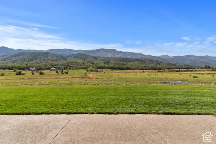 View of mountain backdrop featuring rural landscape