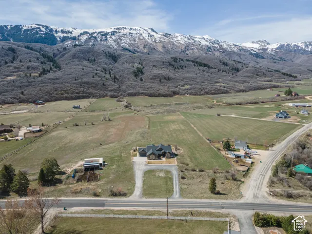 Aerial view of property's location featuring mountains and rural landscape