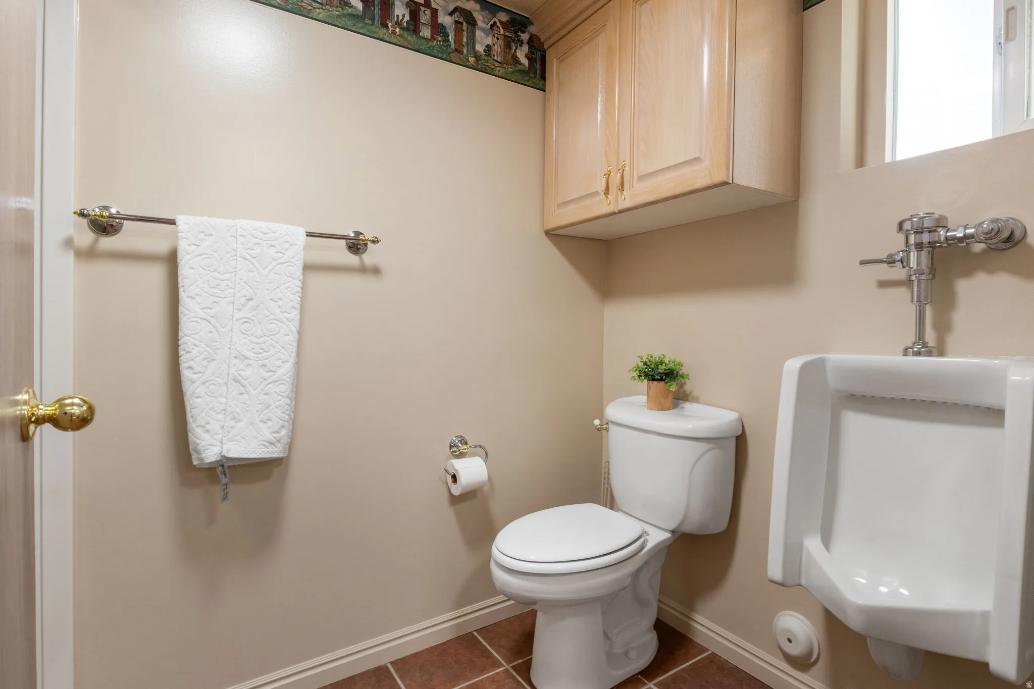 Second bathroom with separate toilet/ shower room and urinal.