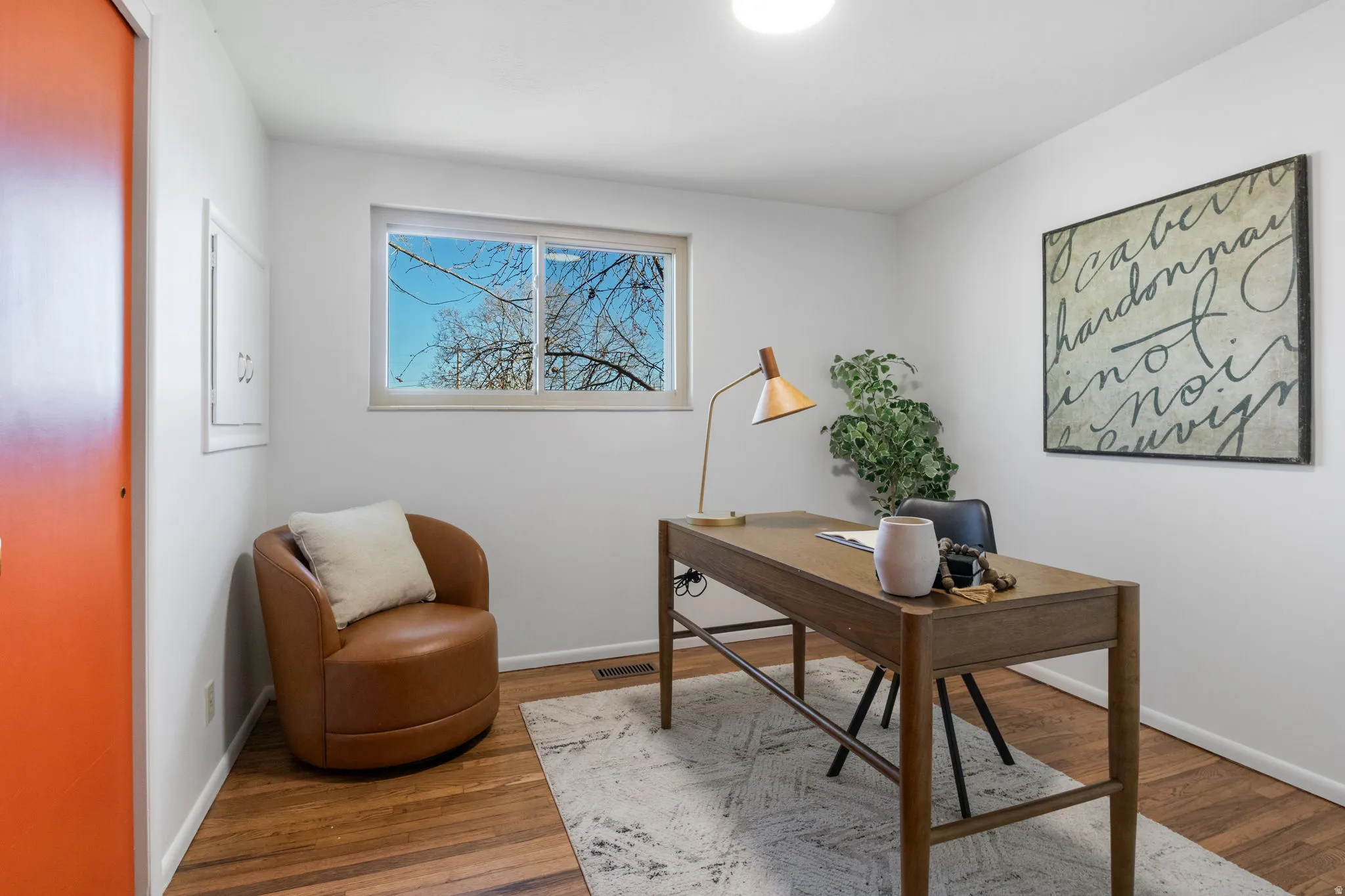 Bedroom #2- staged as home office with refinished hardwood floors.