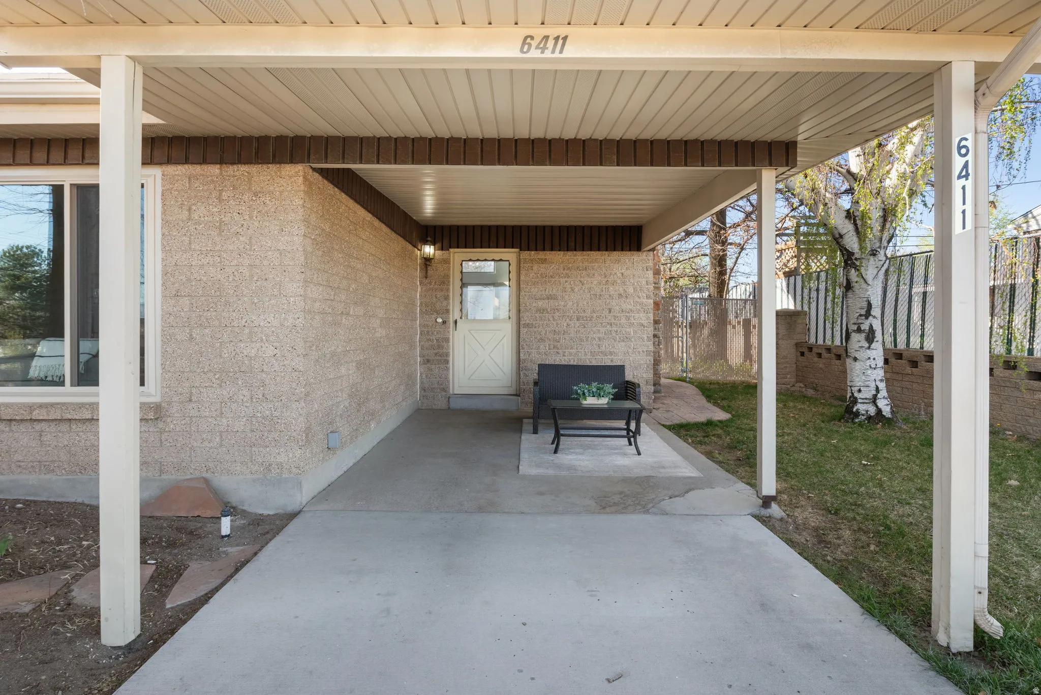 Front carport may also be covered patio space.