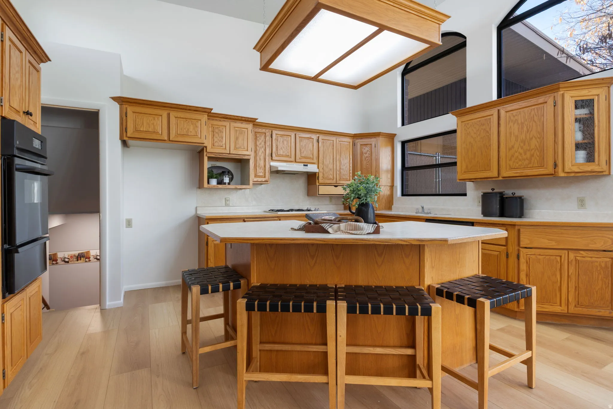 Kitchen has solid wood cabinetry, roll out shelves, gas cook top and wall oven.