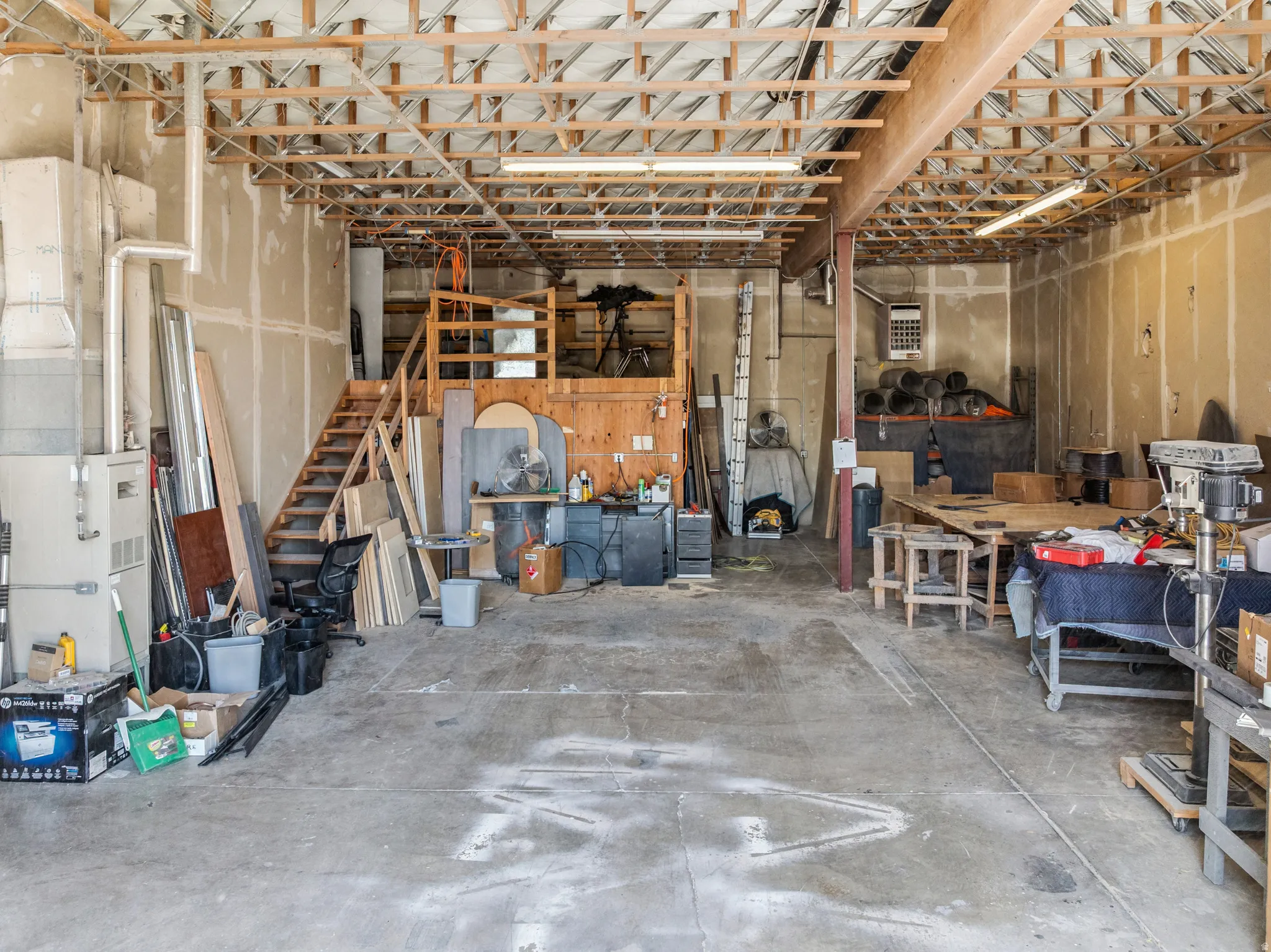 Garage featuring a heating unit and heating unit