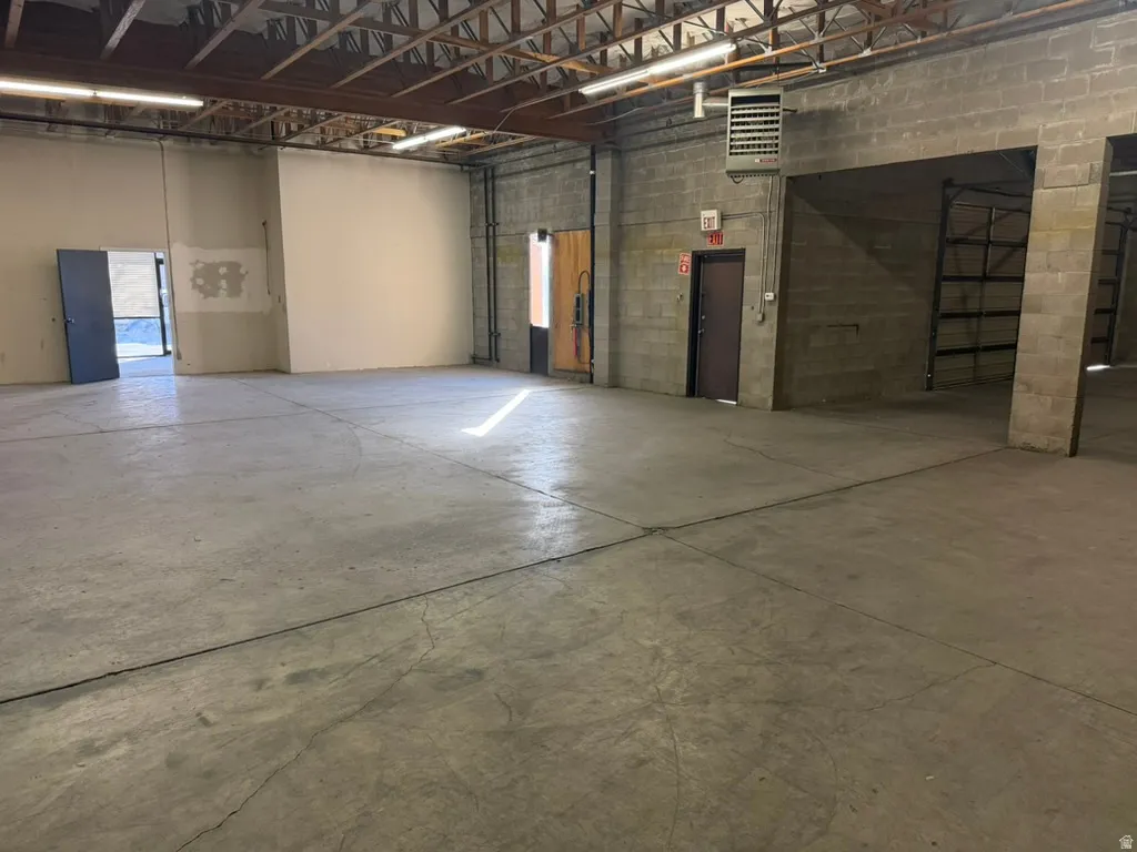 Garage with concrete block wall and a heating unit