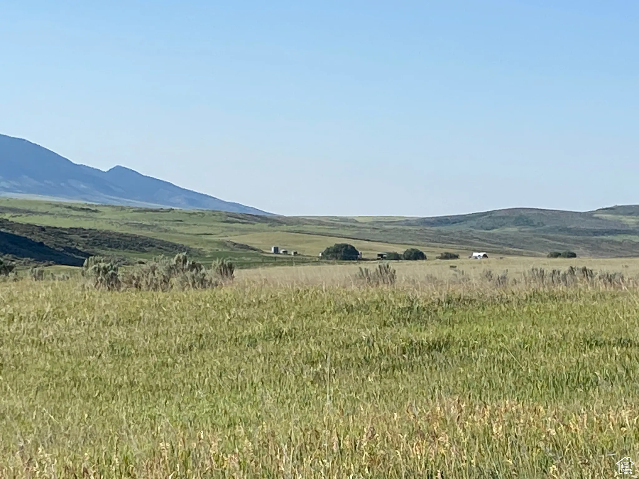 View of mountain background featuring rural landscape