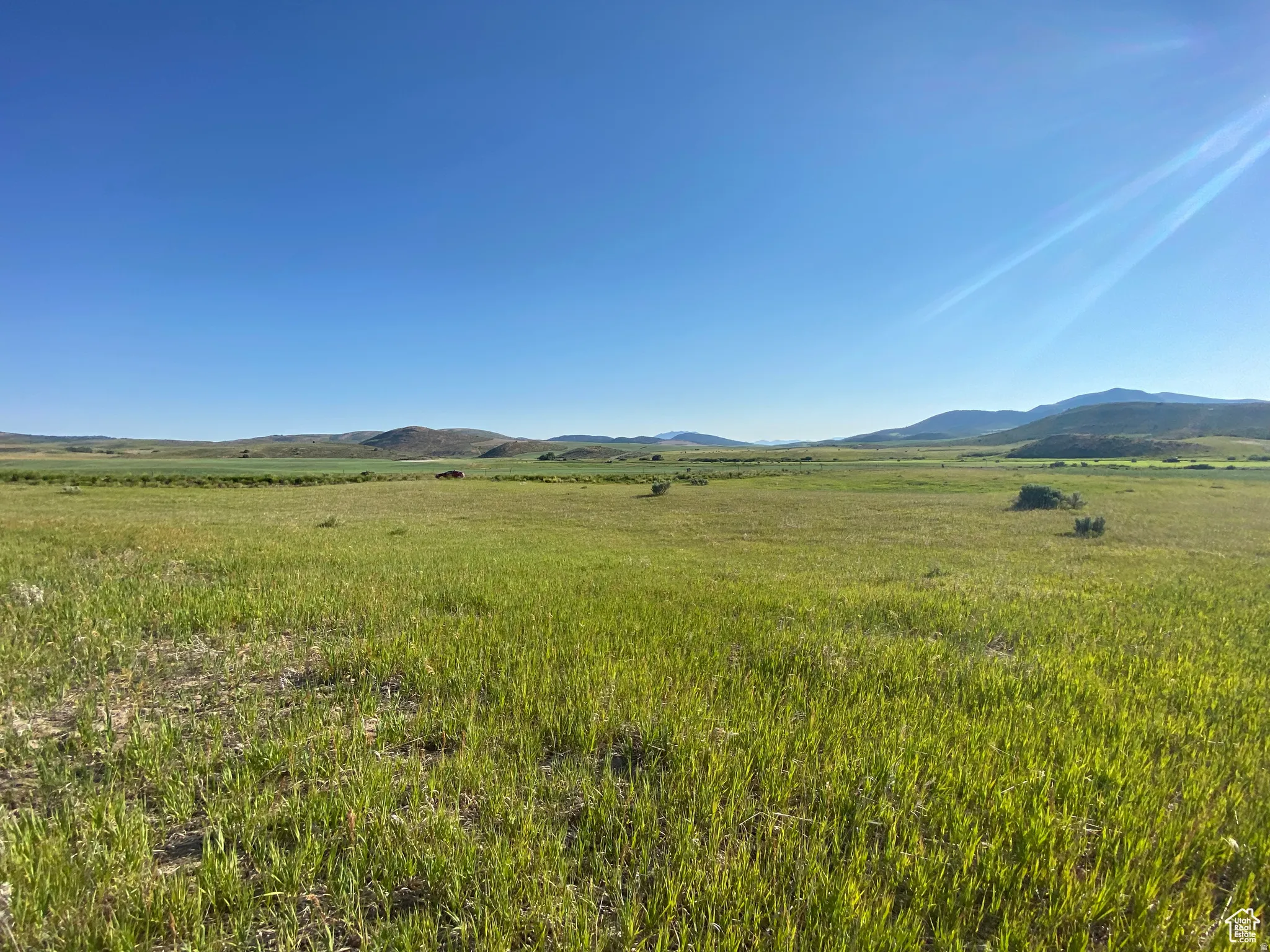 View of mountain background featuring rural landscape and agricultural land