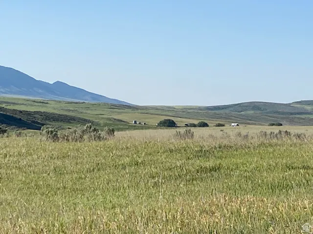 View of mountain background featuring rural landscape