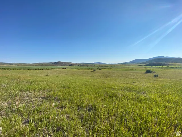 View of mountain background featuring rural landscape and agricultural land