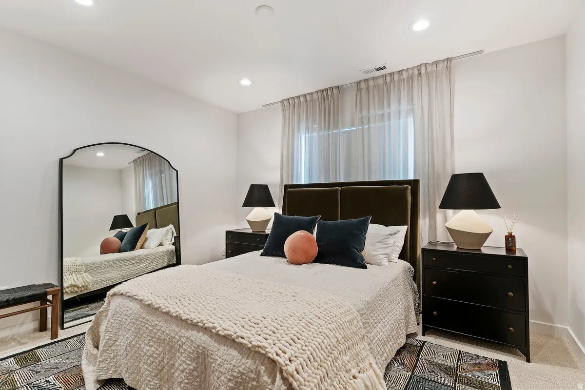 Carpeted bedroom with recessed lighting