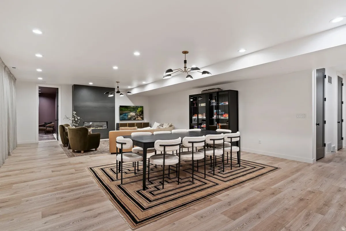Dining area featuring light wood-style floors and recessed lighting