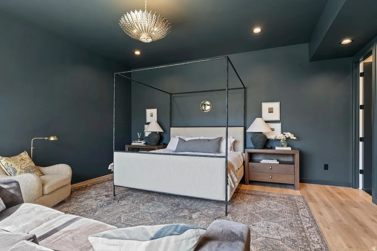 Bedroom with wood finished floors and recessed lighting