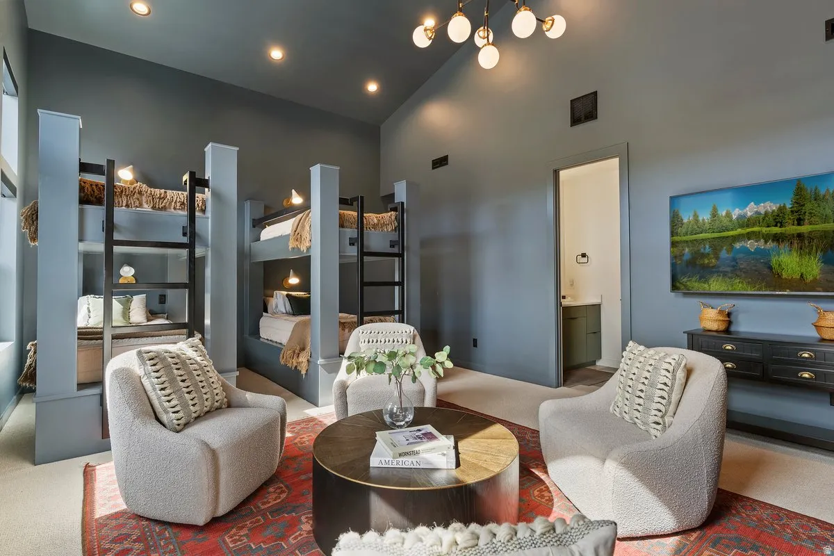 Living area featuring carpet, lofted ceiling, and recessed lighting