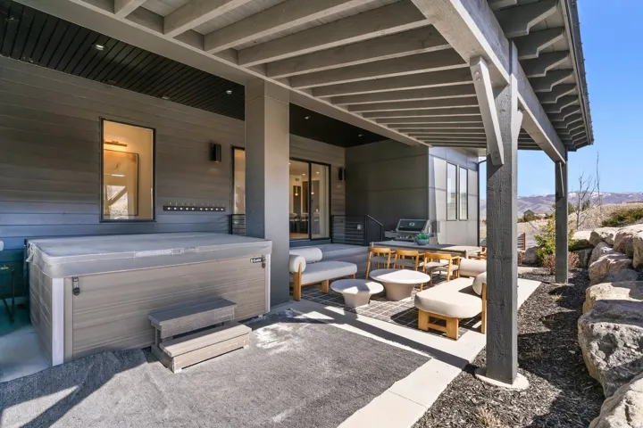 View of patio featuring a hot tub