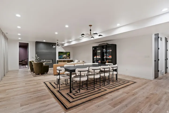 Dining area featuring light wood-style floors and recessed lighting