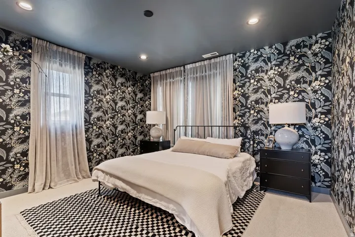 Bedroom featuring wallpapered walls, carpet flooring, and recessed lighting