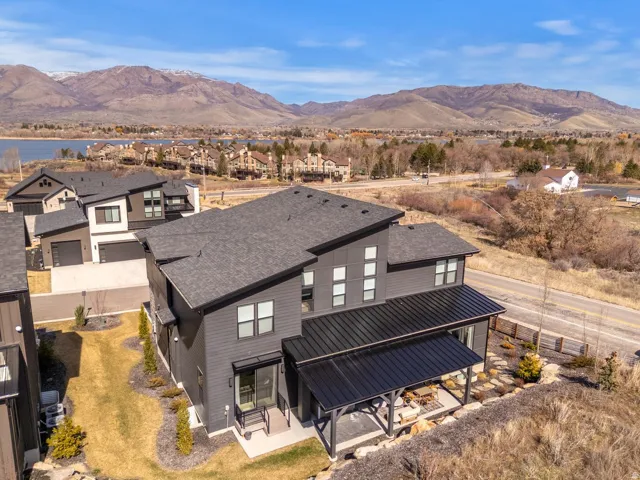 Aerial perspective of suburban area featuring a mountainous background