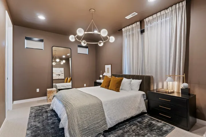 Bedroom featuring carpet floors and a chandelier