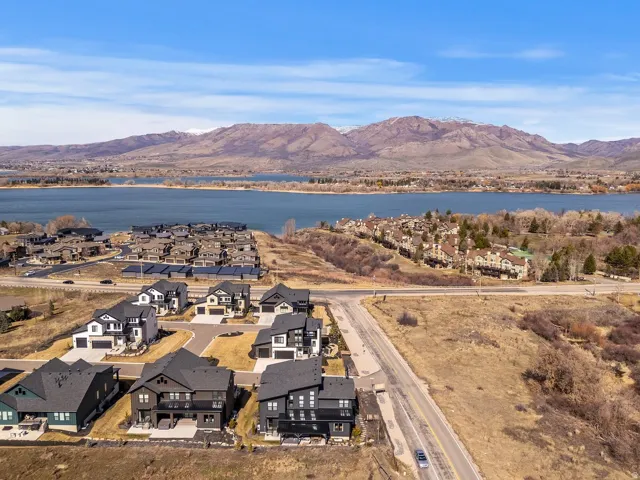 Aerial perspective of suburban area with a water and mountain view