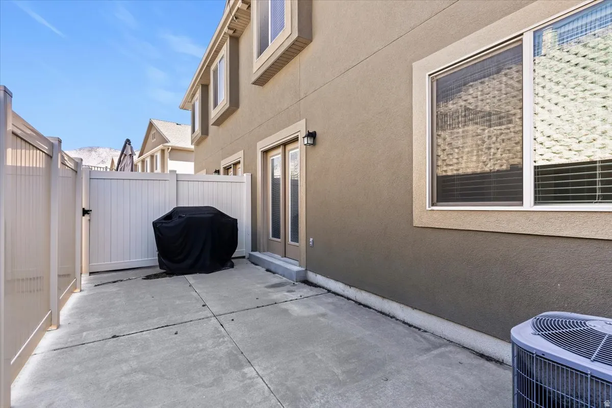 View of patio / terrace featuring a gate and area for grilling