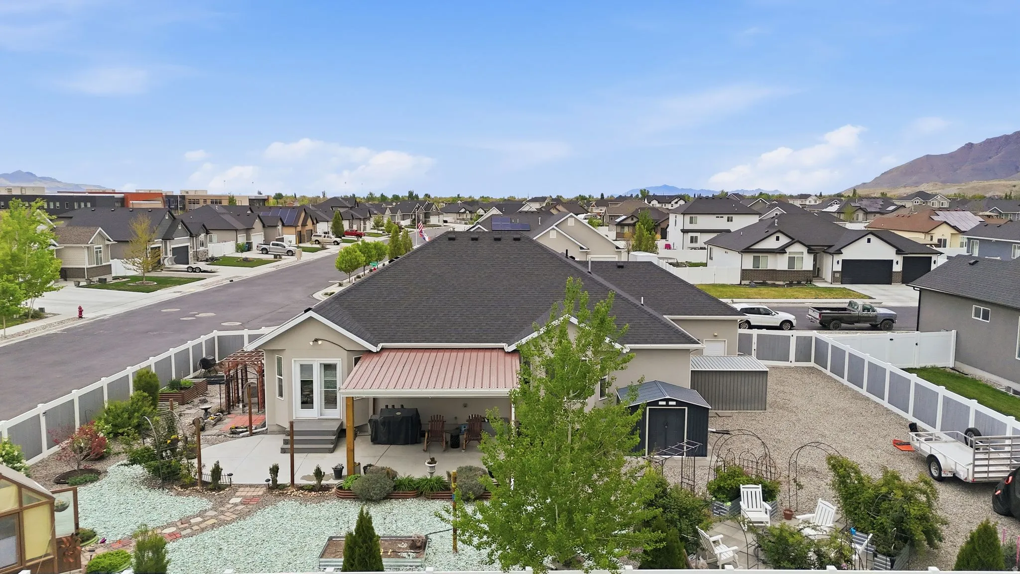 Aerial perspective of suburban area featuring a mountain backdrop