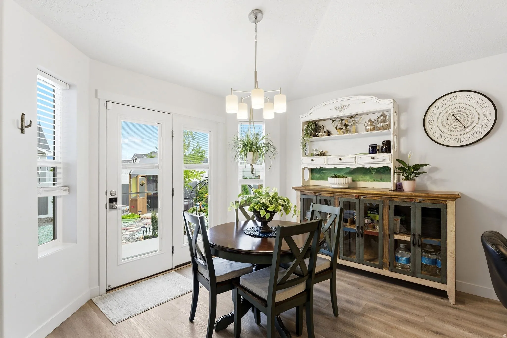 Dining room featuring light wood finished floors and suspended lighting