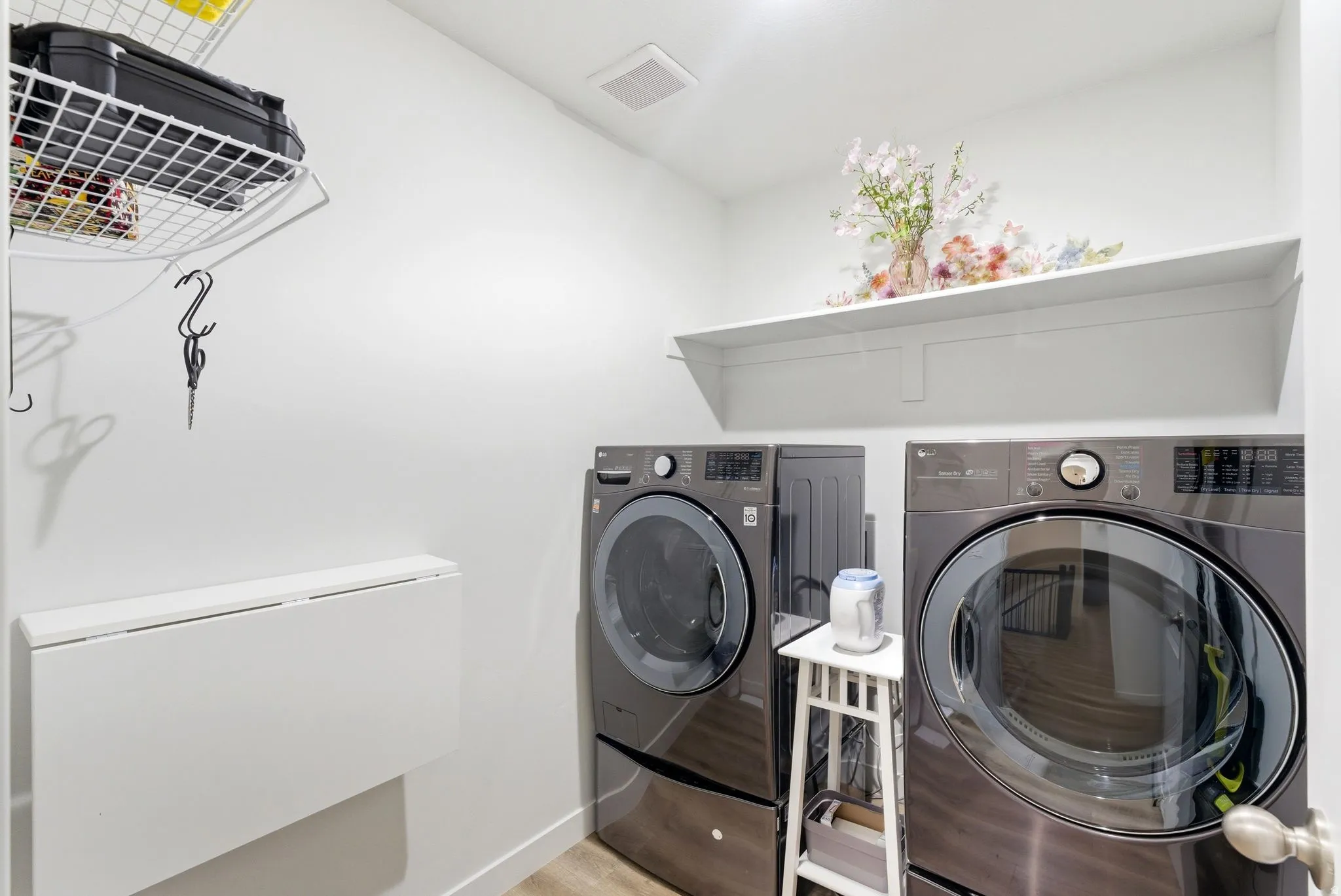 Laundry room featuring separate washer and dryer and baseboards