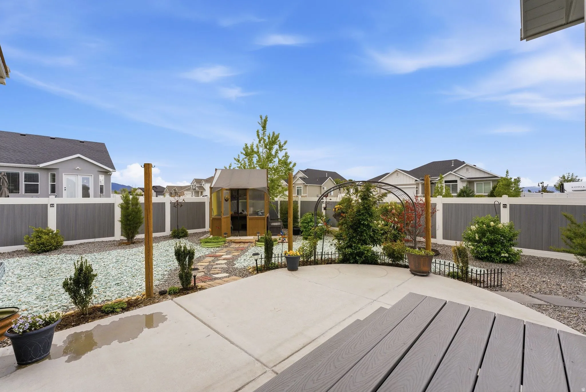 Fenced backyard with a residential view