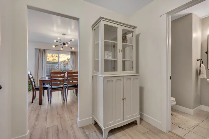Dining room with hanging lights and wood finish floors