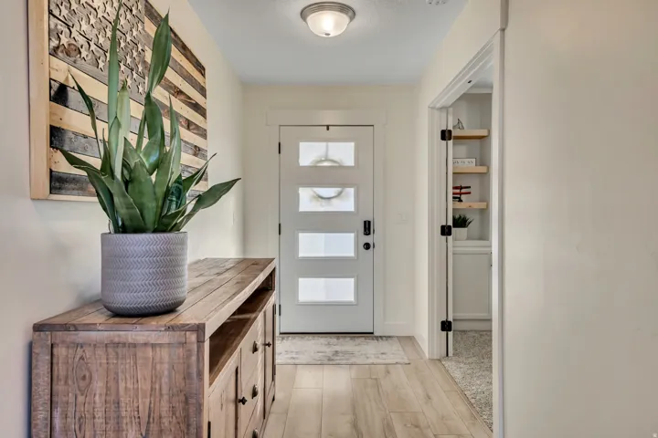 Entrance foyer featuring light wood-style flooring