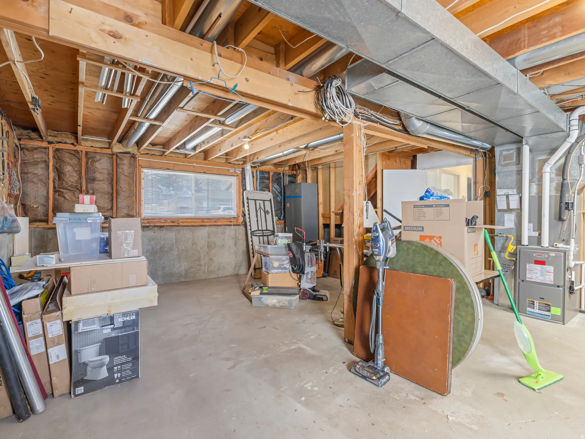 Unfinished below grade area with heating unit