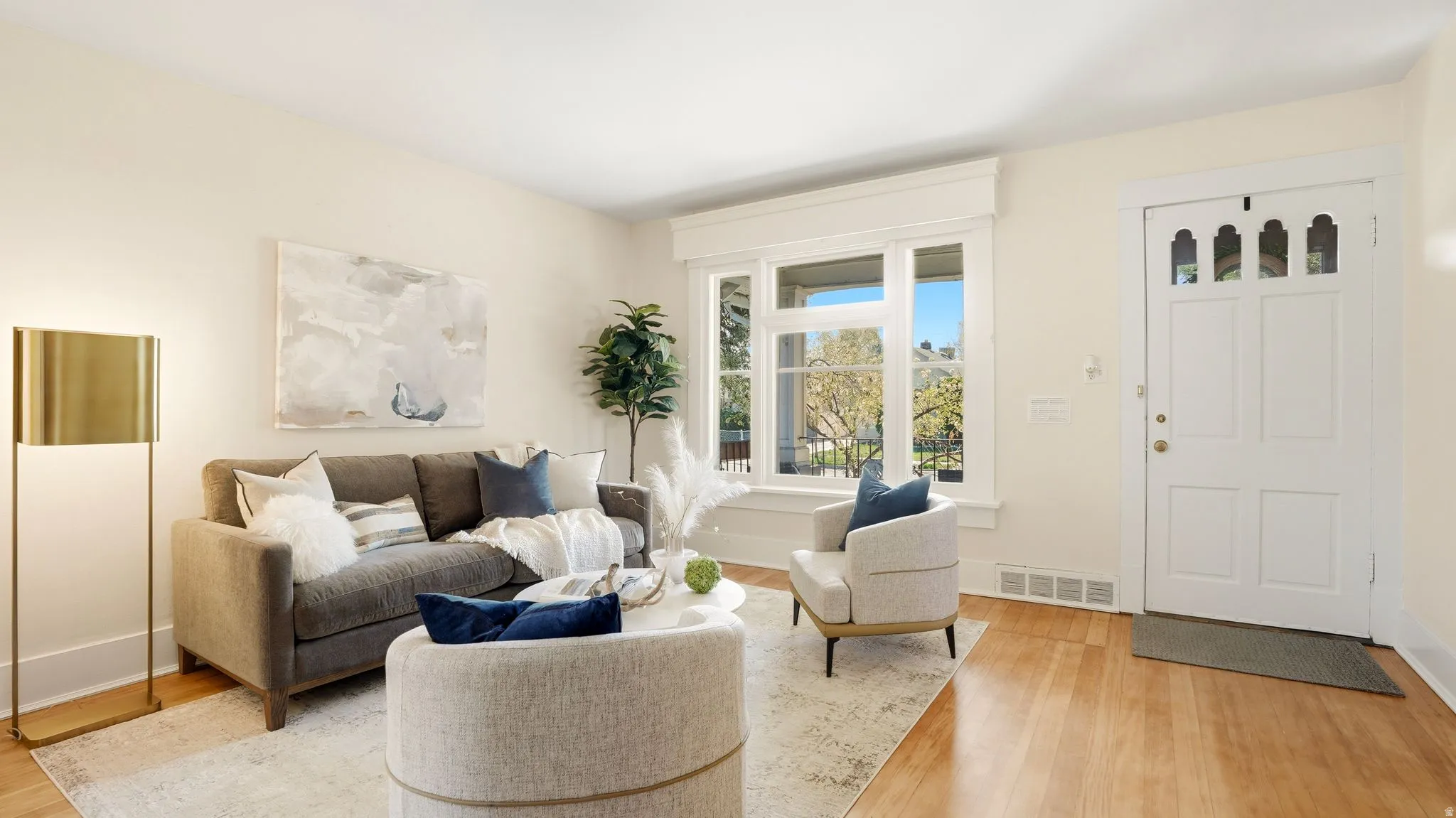 Living area featuring light wood-style floors and baseboards
