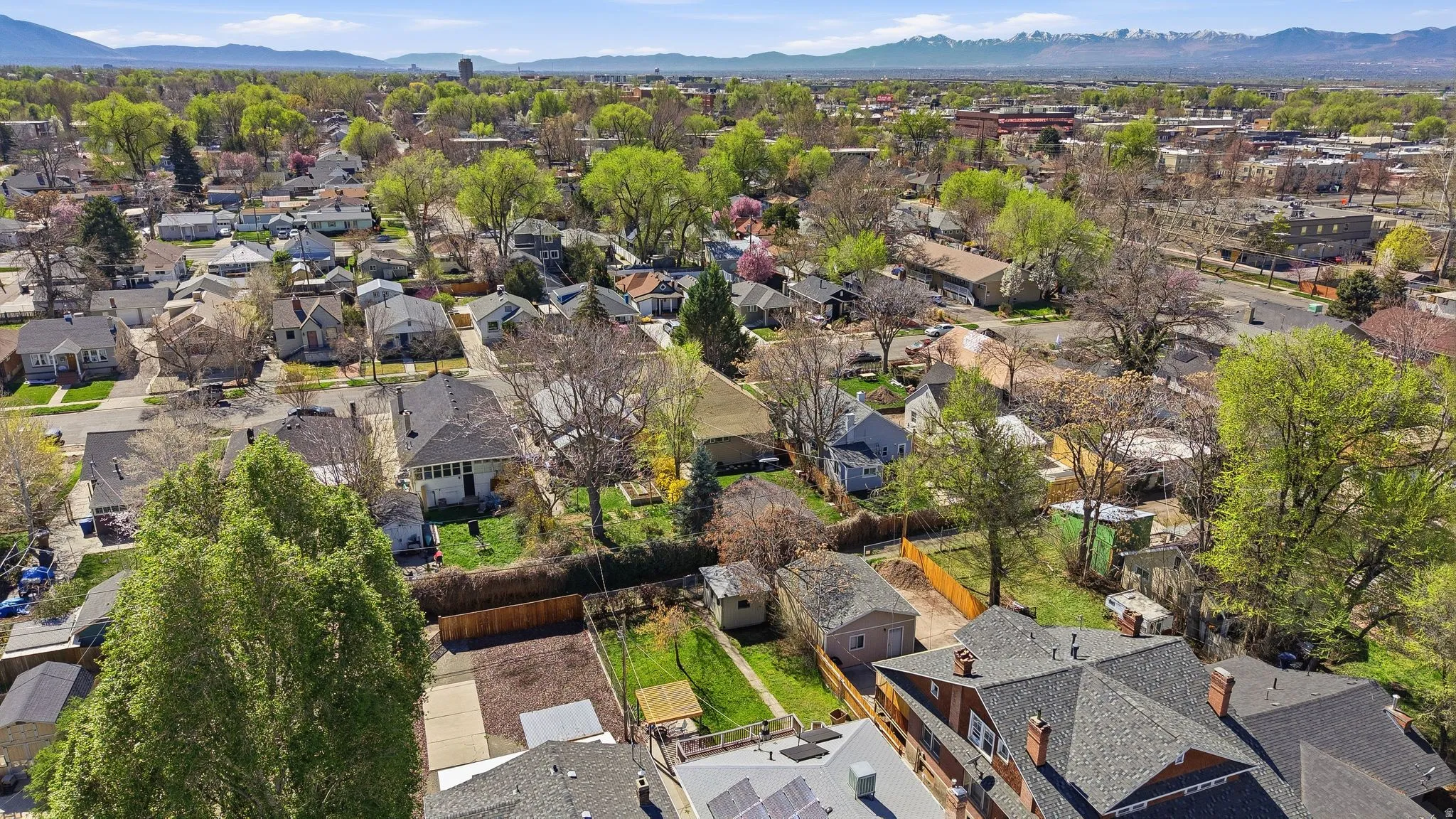 Aerial view of residential area with a mountainous background