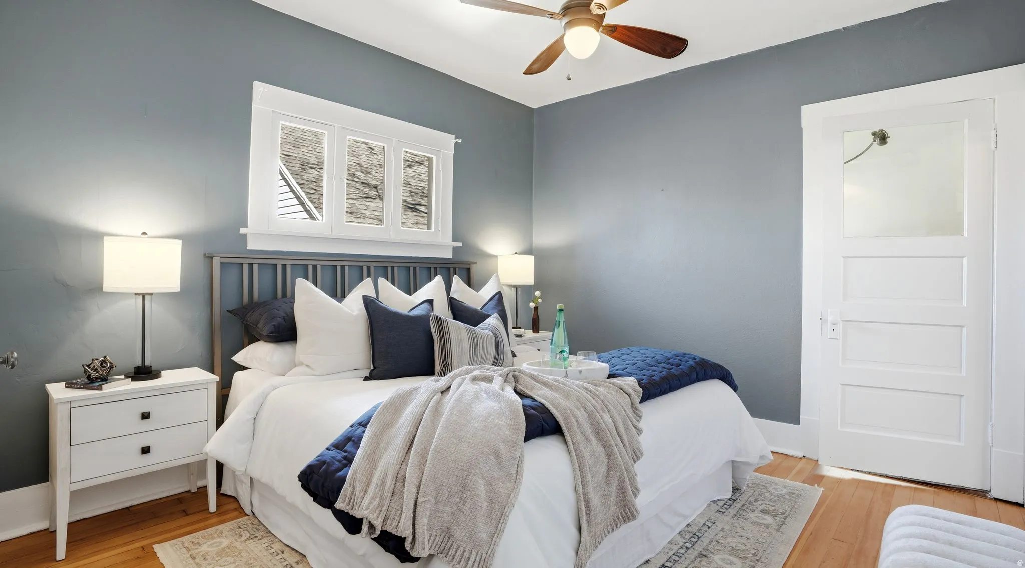 Bedroom featuring light wood-style flooring and ceiling fan