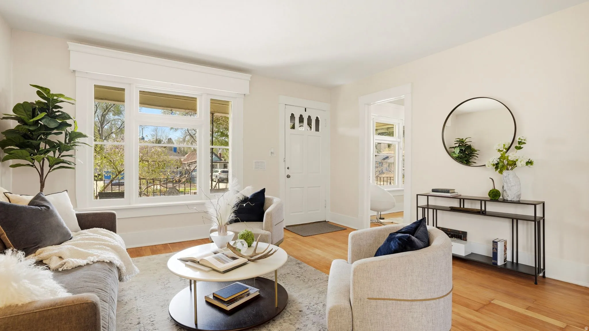 Living room with light wood finished floors and baseboards