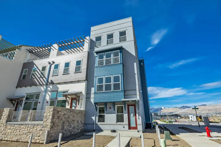 View of front of house with a mountain view and stucco siding