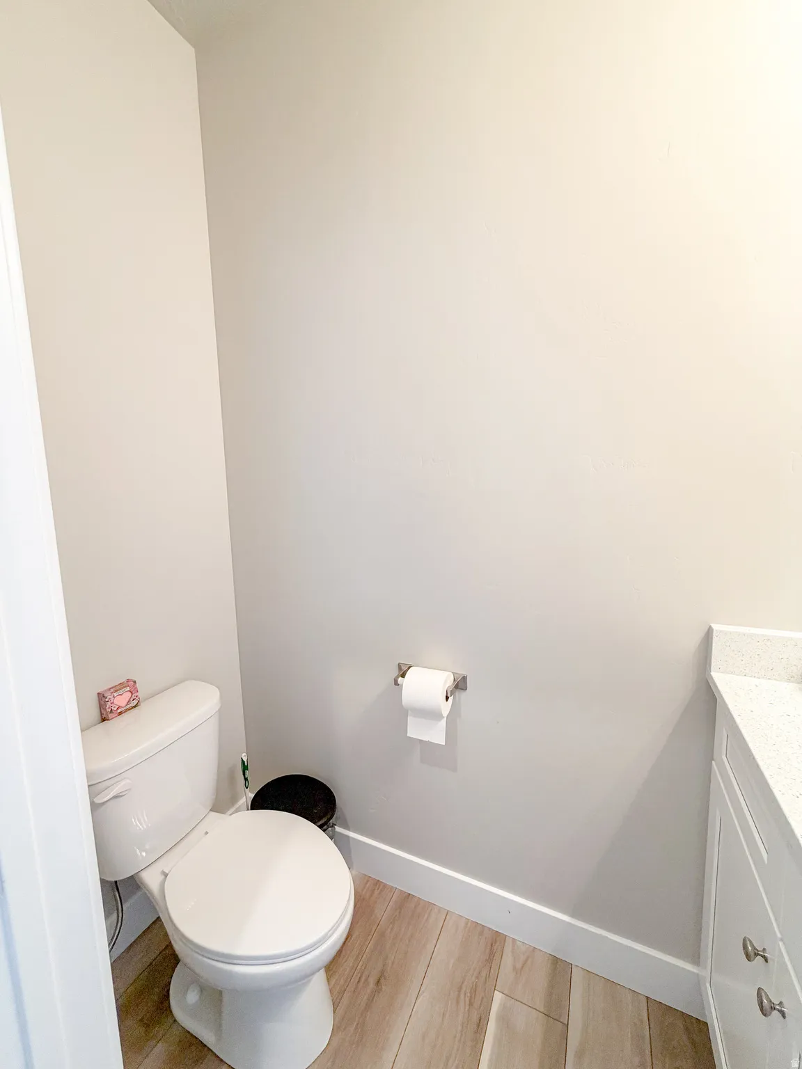 Half bath featuring quartz countertop