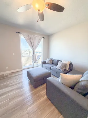 Living room with balcony access.